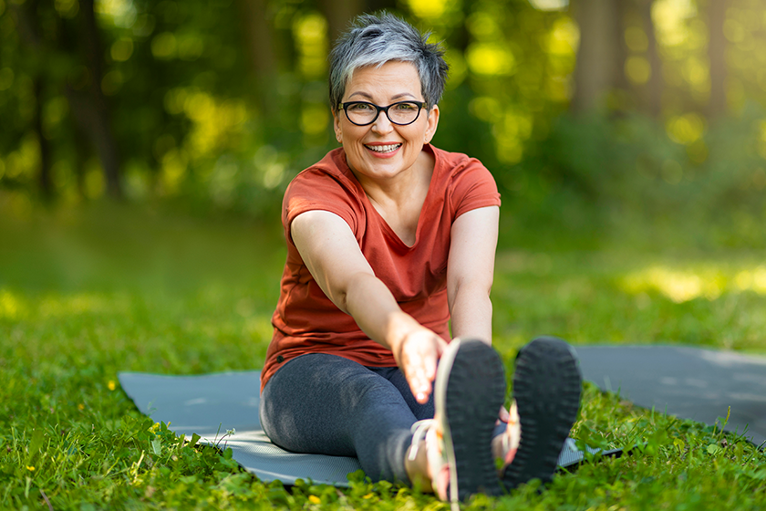 Beautiful Happy Senior Woman Training Outdoors