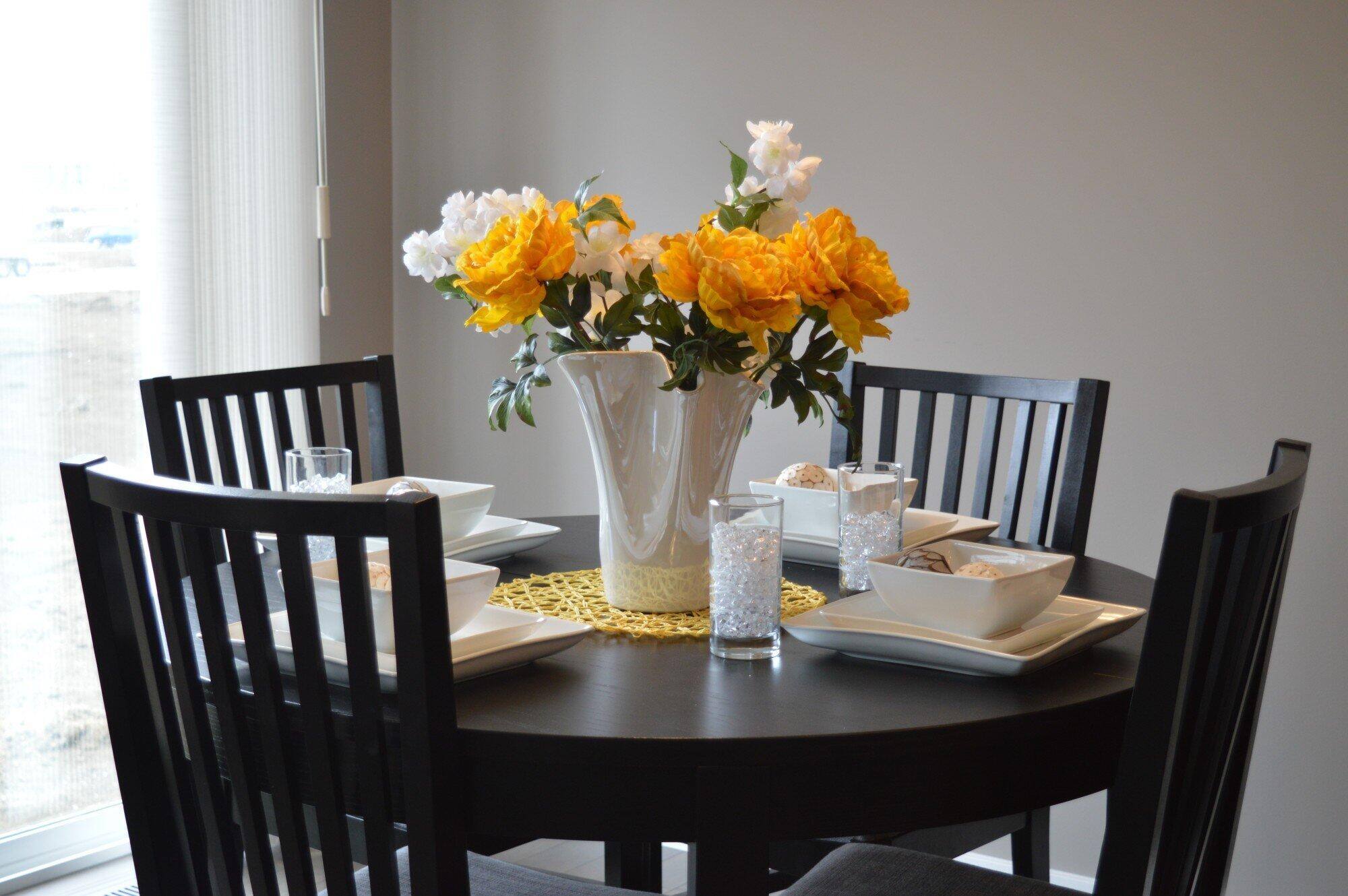 Dining table with a flower vase on the center